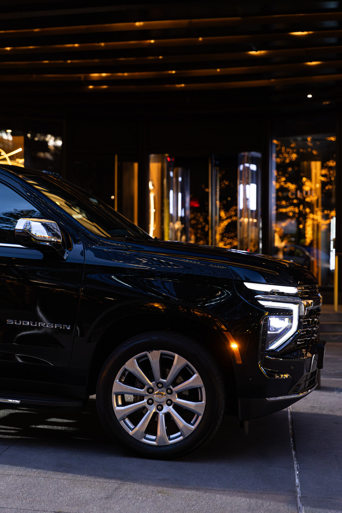Front-side detail of a black Chevrolet Suburban